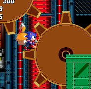 Slowly rotating giant cogs can turn in either direction, and their sticky-out bits can be used as platforms.