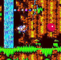 POW right in the kisser! Sonic is caught completely off-guard by a mysterious assailant bursting out from under the ground, knocking the emeralds clean out of him and scattering them across the floor!