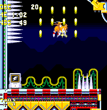 Tails needs to carefully fly past the spikes as he goes higher. The route at the top leads through a hidden corridor, past a Special Stage ring and eventually to a later point in the act.