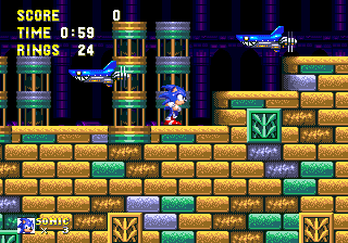 Multi-coloured bricks, mostly yellow, build the foreground, occasionally with larger patterned ones. Paths are decorated only with these hollow pillars with several swinging pendulums inside.