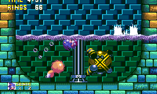 The mid-boss is a spherical robot with four circling missiles to protect him. He begins by sweeping the bowl from above, coming down either side, and you need to jump over.
