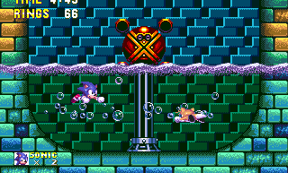 He'll then sit atop the column in the middle and begin to rotate it, creating a whirlpool that leaves Sonic and Tails helpless as they drift round and round.
