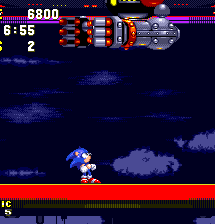 Phase 2 of the attack. Eggman will float back and forth above the arena, his arms hanging just along the top of the screen. You know he's planning something, so avoid alignment with him. Preferably by spin dash..