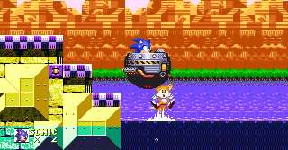 At the end of the first boss, walk off to the side to land in.. an Eggmobile?! Sadly, Tails' journey, if accompanying Sonic, is cut short here as he dies simply by missing the Eggmobile and falling to his death. in Sonic 3 alone, he fails to come back to life.