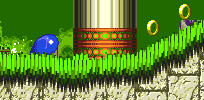 The trick for Sonic or Tails is to rev your spin dash before you get on the slope. Start it from about here, before the slope begins and in front of the decorative pillar that's to the left of it..
