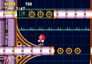 As part of the main route, you must negotiate more tricky circular platforms, these ones now crossings opposing curves in the walls. Spin dash with plenty of force up the curves when the time is right so that the strings don't crush you into the walls, and then use them as platforms to continue.