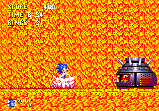 Take a pink platform on the far left column and it'll eventually settle down on the lava-bed at the bottom. Here, Eggman will pop up on the right. Show time..