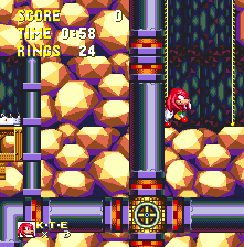 After a very lengthy staircase upwards, Knuckles will find a door and button that sneaks him through Sonic's route, at a relatively early point along it.