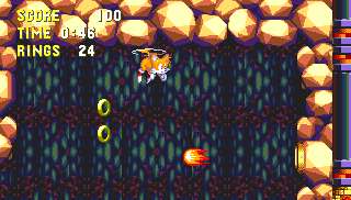 This next one is just for Tails. Carry on from the last ring until you come to the checkpoint, at the bottom of some spring-covered steps. You can fly straight up through the ceiling of this room to find the ring in a hidden room above.