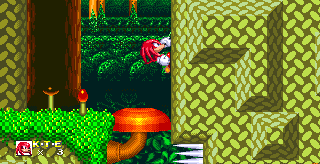 Knuckles' very first introduction to his fancy new wall climbing move. Simply jump up against this wall and then press jump again to latch onto it. From there, up and down buttons will allow you to climb.