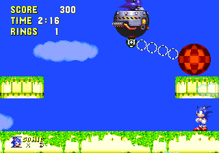 It's the classic Green Hill Zone boss! Same strategy still applies, simply hide under one of the two platforms as the large pendulum swings past, staying close to the side of the screen..