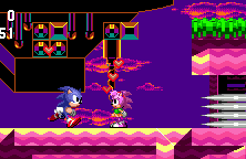 At the start, you'll be met by Amy Rose. Just stand there with her for a moment and don't touch the spikes - we're doing a cutscene! Shhh..