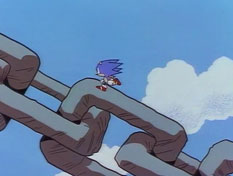 In no time, Sonic has sped down a slope, off a ramp in the rock and up in the air toward the chain, which he climbs up to the planet.